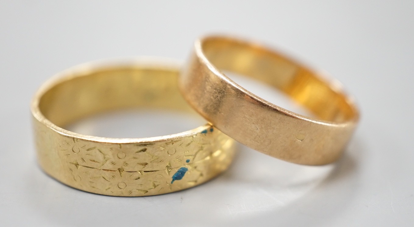 An engraved 18ct gold wedding band, size Q, 5.2 and a yellow metal band, 3.2 grams.